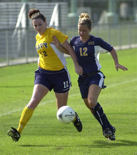File:US Navy 030907-N-9693M-007 Navy midfielder Ariana Downs tries to steal the ball from ...