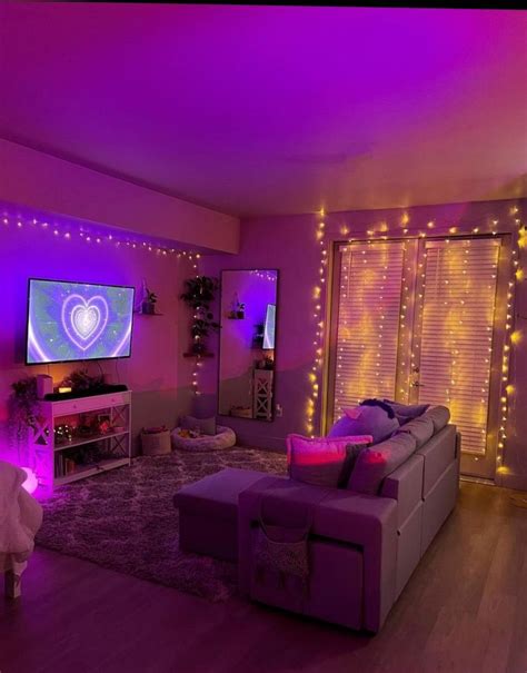 a living room filled with furniture and lots of purple lights on the ...