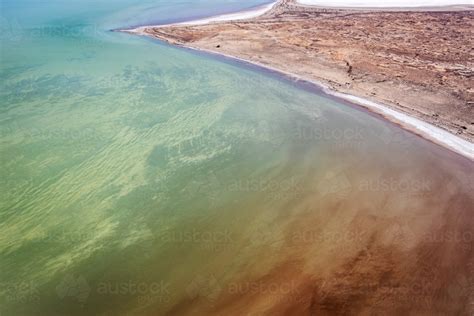 Image of aerial view of water in Lake Eyre - Kati Thanda - Austockphoto