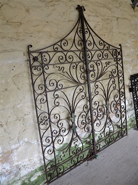 A pair of decorative wrought iron garden gates - ARCHITECTURAL HERITAGE