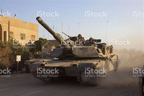 "M1 Abrams Main Battle Tank crew prepares for combat patrol in ...