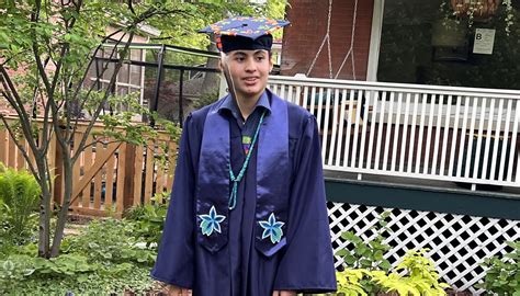 Evanston Township High School graduate refuses to give up Indigenous adornments on cap, barred ...