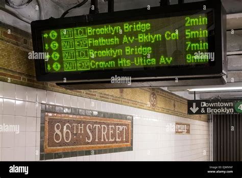 Subway train arrivals schedule shown on a digital readout at East 86th ...