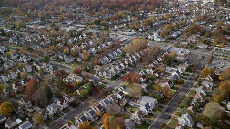 6K stock footage aerial video fly over suburban houses in Autumn, West ...