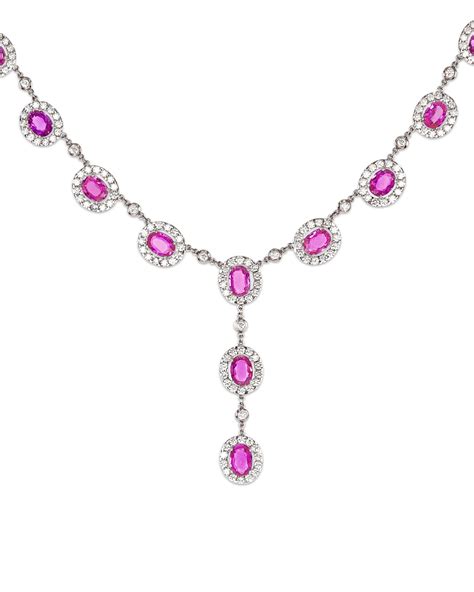 This striking and elegant drop necklace features luminous pink sapphires and bright white ...