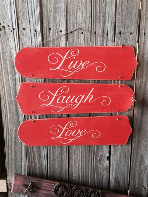 Repurposed fan blades into super cute wall sign. Chalk painted coral, distressed, stenciled, and ...
