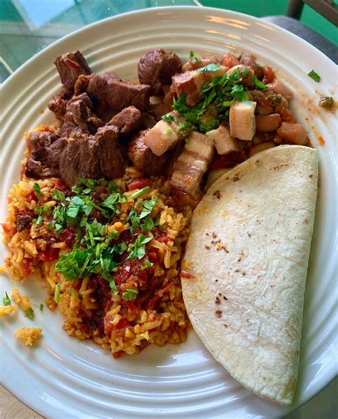 Home made asado de puerco, mexican rice, charro beans and fresh corn ...