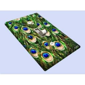 an image of a laptop cover with peacock feathers on it