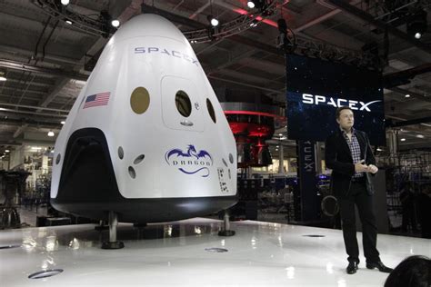 Elon Musk unveils new astronaut-ready spaceship at SpaceX headquarters - Los Angeles Times