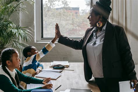 Cheerful black teacher with diverse schoolkids · Free Stock Photo