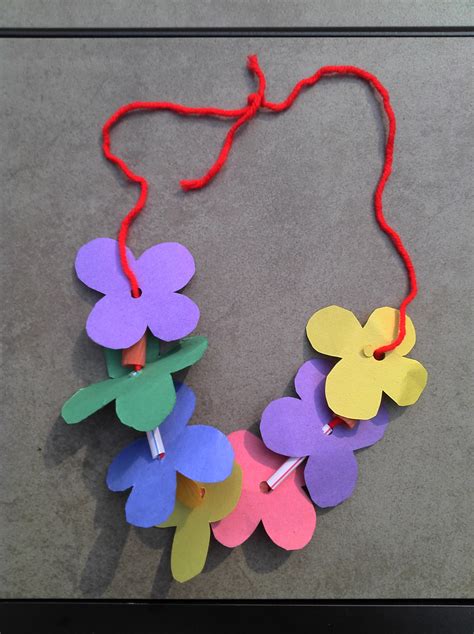 Lei. Can be made with construction paper, yarn, & solid colored straws ...