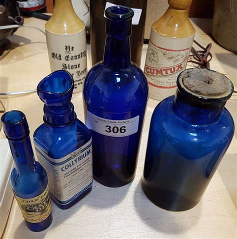 LOT OF 4 COBALT GLASS BOTTLES