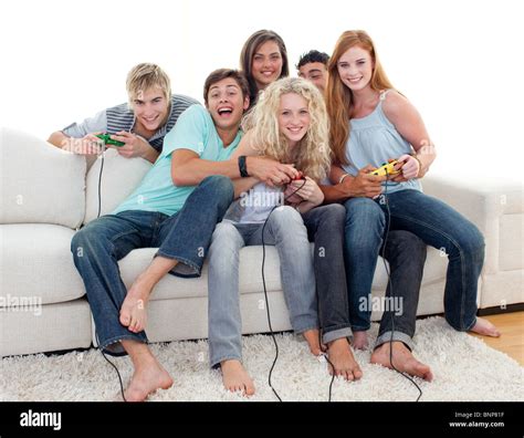 Teenagers playing video games at home Stock Photo - Alamy