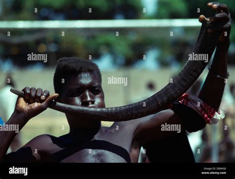 kENYA, Man using animal horn as musical instrument Stock Photo - Alamy