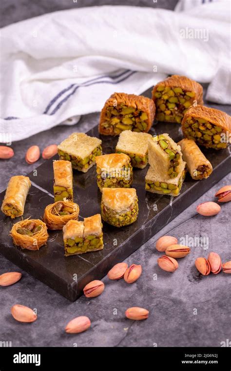 Varieties of pistachio baklava. Varieties of baklava on a dark background. Traditional Turkish ...