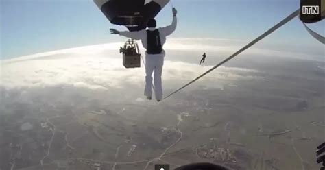 Video: Tightrope walkers attempt to cross between two hot air balloons floating 10,000ft up and ...