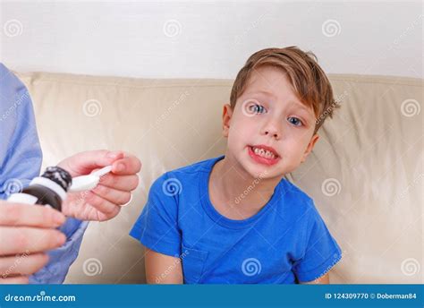 The Boy is Sick. Mom Treats Drugs Stock Photo - Image of little, girl: 124309770