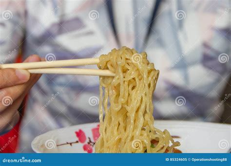 Chopsticks and noodles stock image. Image of length, junk - 85324605