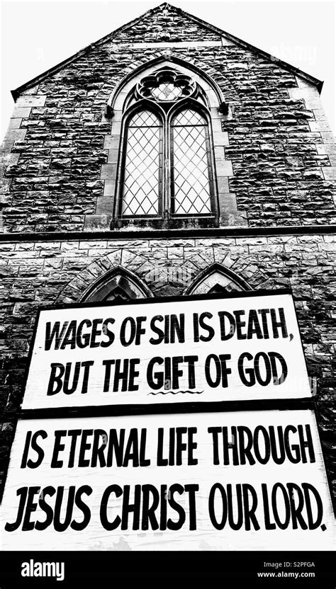 Large Billboard outside Church reading “Wages of sin is death but the ...