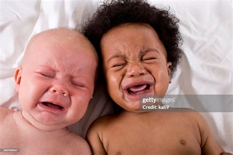 Faces Of Two Multiracial Babies Crying Together High-Res Stock Photo - Getty Images