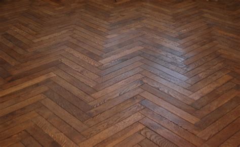 The floor in this image is a Herringbone Pattern. The wood has been hand scraped to creat ...