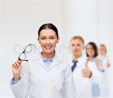 smiling female doctor with eyeglasses | Stock image | Colourbox