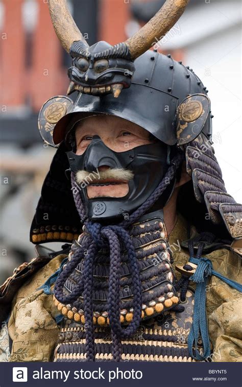 Man dressed in full samurai armor complete with kabuto helmet and mempo ...