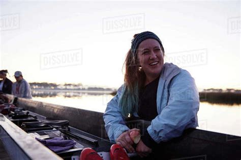 Portrait smiling, confident female rower at scull - Stock Photo - Dissolve