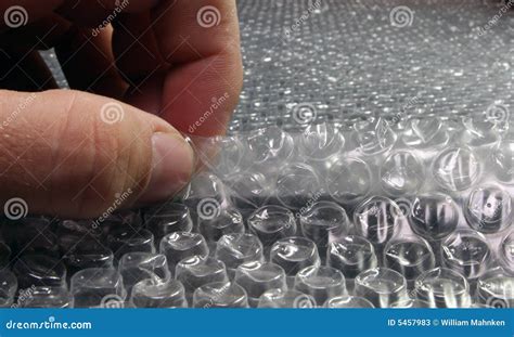 Popping Bubble Wrap stock image. Image of thumb, deflate - 5457983