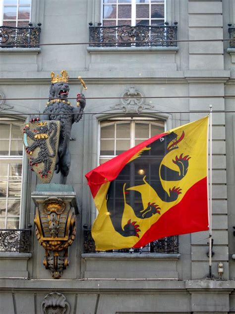 A heraldic lion and the Bear flag of Bern. Bern, Old City, Capital City, Public Art, Metropolis ...