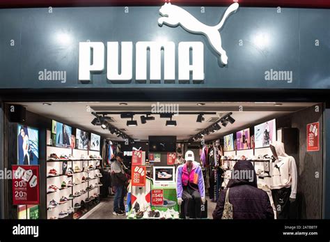 German multinational sportswear brand Puma store and logo in Hong Kong Stock Photo - Alamy