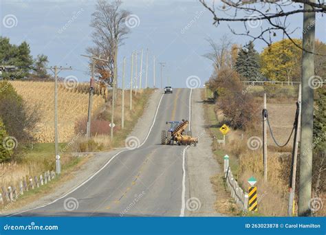 Tractor Towing Farm Machinery on a Country Road Stock Photo - Image of gravel, fresh: 263023878