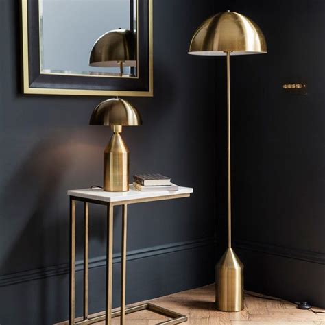 Albany Gold Floor Lamp Stylish floor lamp with a metal frame in a gold finish Featuring a half ...