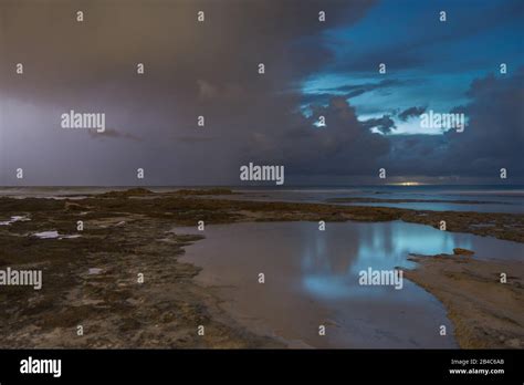 Storm weather with lightning on sea beach Stock Photo - Alamy