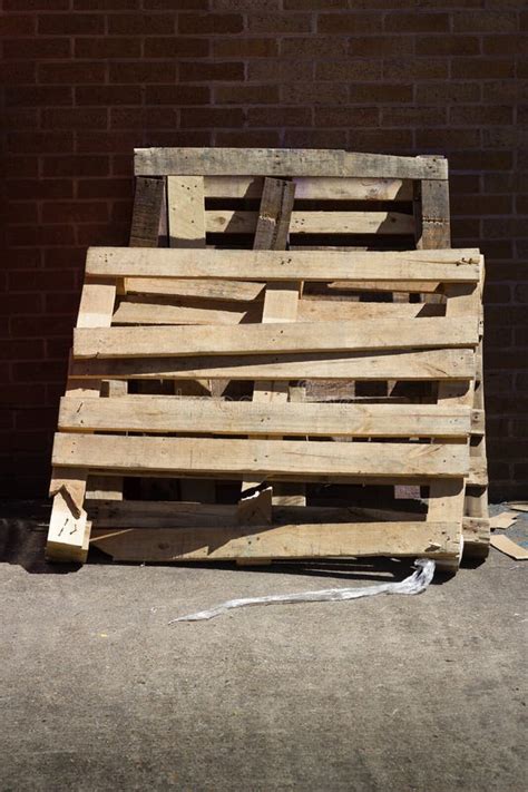 Pallet With Broken Tiles Left On Grass During Flood Stock Photo - Image of green, grass: 113804950