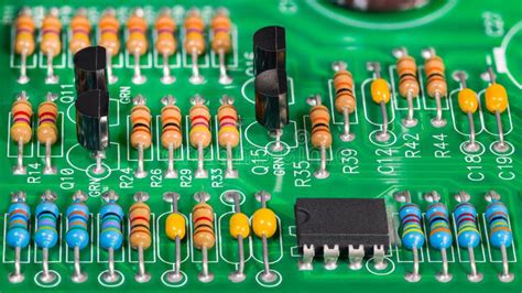 Colored Electronic Components. Resistors, Transistors, Capacitors and ...