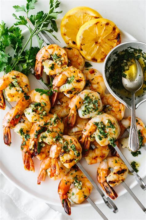 Garlic grilled shrimp skewers are marinated in a garlic herb mixture, then grilled to perfection ...