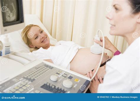 Pregnant Woman Getting Ultrasound From Doctor Stock Photography - Image: 5943702