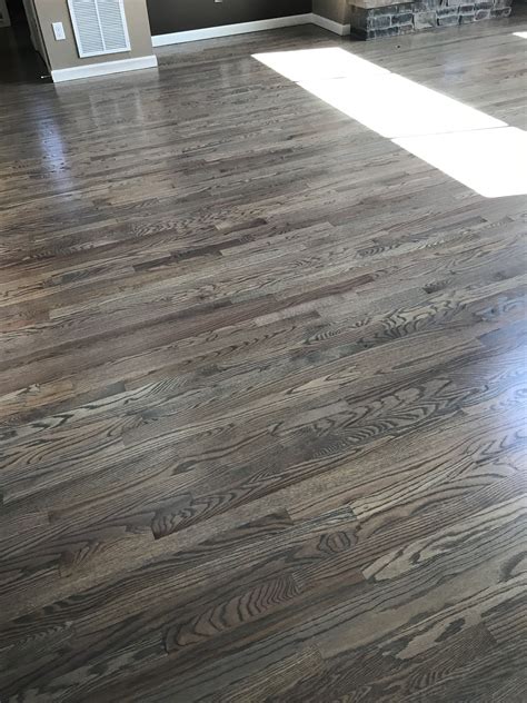 Red oak floors stained with classic gray #oakhardwoodflooring | Oak floor stains, Hardwood floor ...