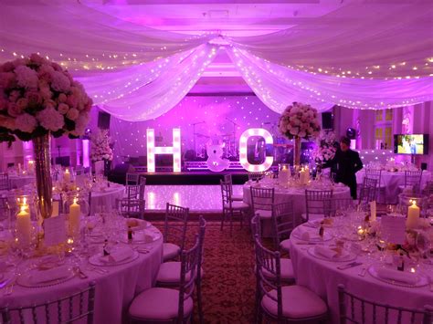 Wedding at Four Seasons Hotel Hampshire. White LED dancefloor, fairy light ceiling drape, lit ...