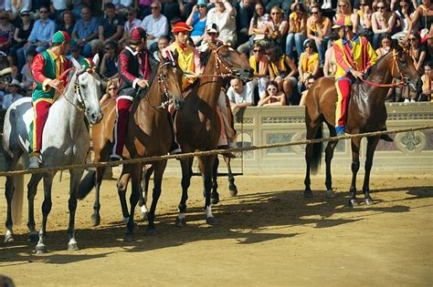 Horses & jockeys in the wildest horse race in the world, Italy's Il Palio di Siena. It has been ...