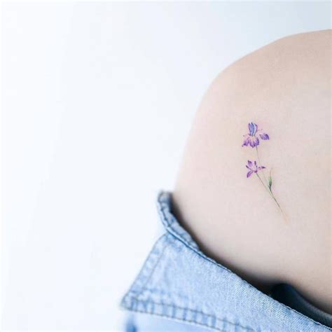 Iris flower tattoo on the left shoulder blade. Iris Flower Tattoo, Tiny Flower Tattoos, Iris ...