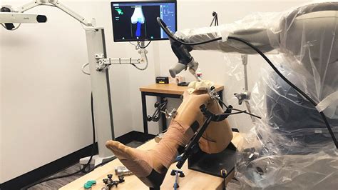 an artificial leg is placed on a table in front of a computer monitor ...