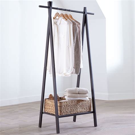 This sleek metal garment rack is perfect for small spaces or rooms with ...