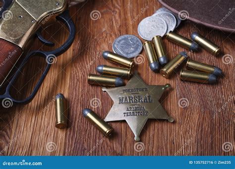 Wild West Rifle, Ammunition and Sheriff Badge Stock Photo - Image of rope, shot: 135752716