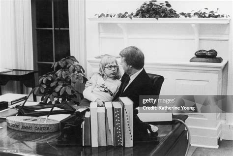 American President Jimmy Carter talks with his daughter Amy, who sits ...