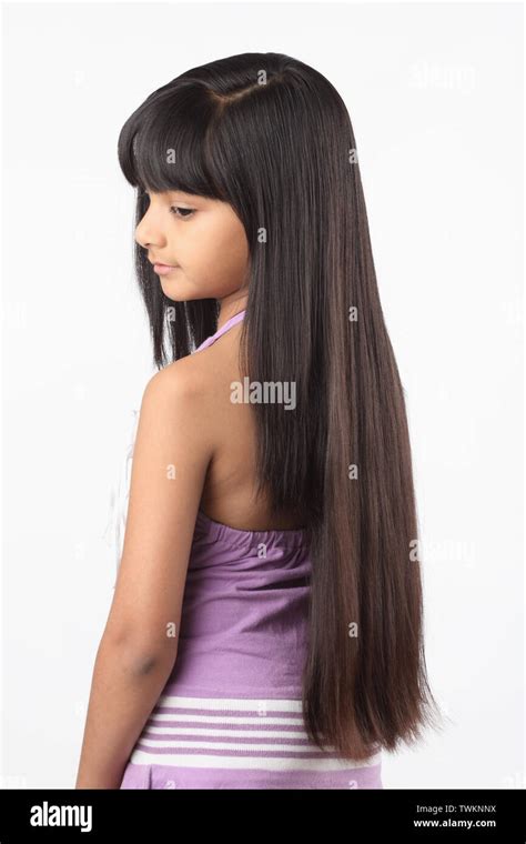 Rear view of a girl showing straight hair Stock Photo - Alamy