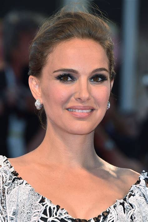 the actress is smiling for the camera on the red carpet at the venice film festival