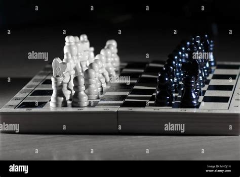 chess composition on dark background.strategy concept Stock Photo - Alamy