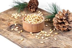 Almonds, hazelnuts, pine nuts, pistachios, cashews and filbert in triangular bowls (Flip 2020 ...